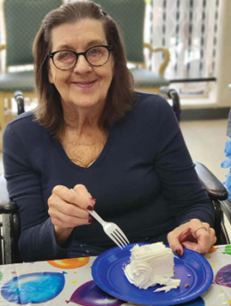 Cumberland Nursing and Rehab woman Resident enjoying her ice cream and cake